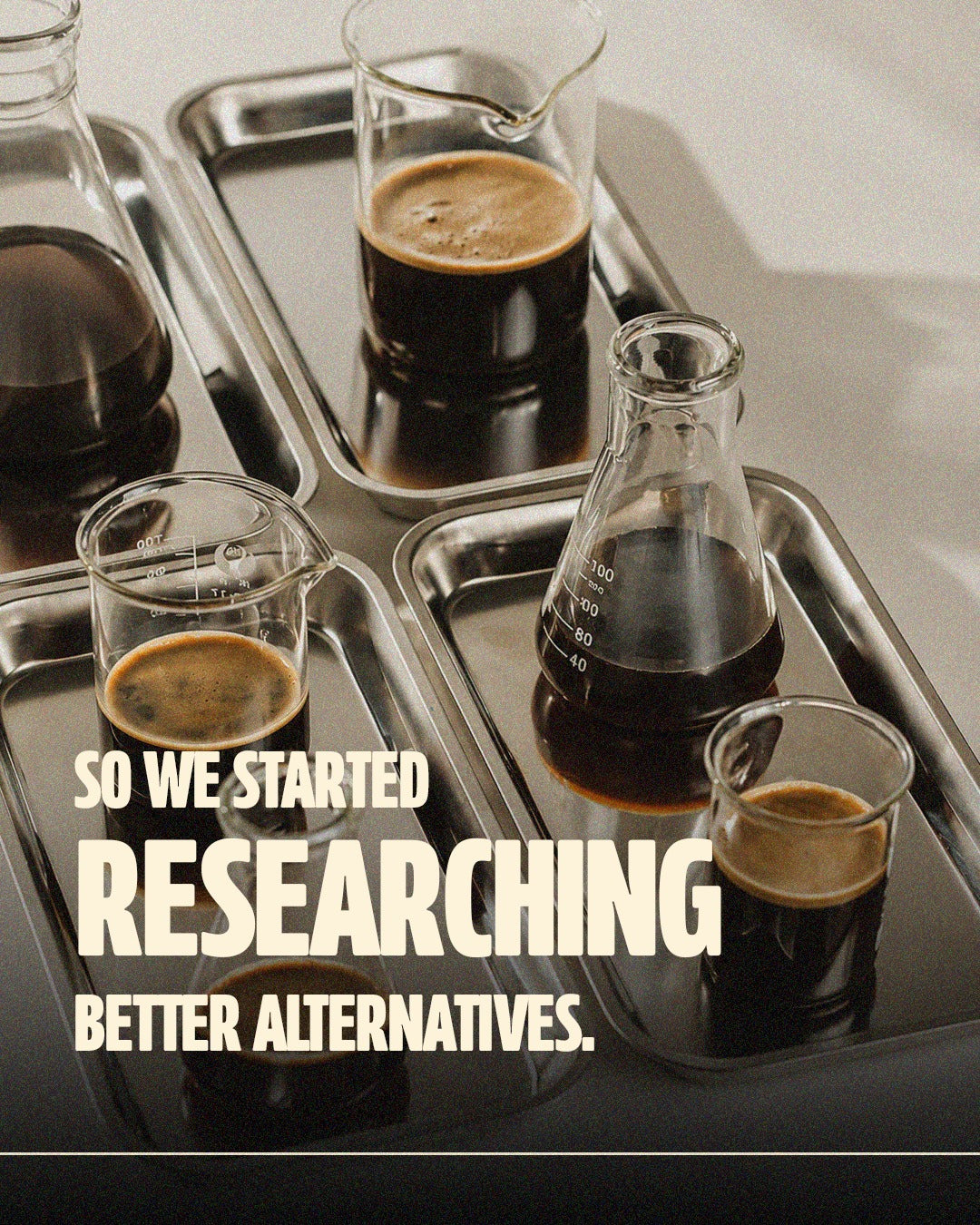 Coffee samples being compared in laboratory glassware